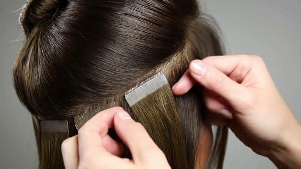 tape extensions move up by so posh hair technician